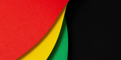 curved shapes in red, yellow, and green on a black background